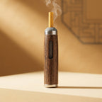 A close-up view of a handcrafted solid walnut ashtray showing detailed wood grain patterns on a neutral tabletop.